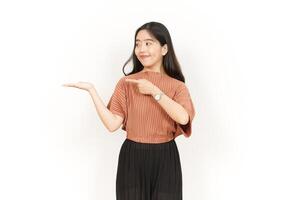 Showing and Presenting Product on Open Palm Of Beautiful Asian Woman Isolated On White Background photo