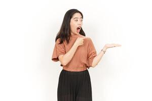 Showing and Presenting Product on Open Palm Of Beautiful Asian Woman Isolated On White Background photo
