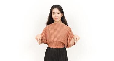 Showing Product and Pointing Down Of Beautiful Asian Woman Isolated On White Background photo