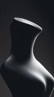 An Elegant Black Mannequin Silhouette Displayed on a Dark Background for Visual Appeal photo