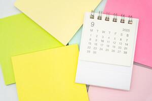 Simple desk calendar for SEPTEMBER 2025 with Sticky note. Calendar concept with copy space. 2025 SEP calendar. photo
