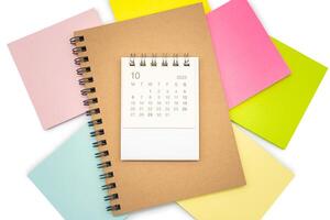 Simple desk calendar for OCTOBER 2025 with Sticky note. Calendar concept with copy space. 2025 OCT calendar. photo