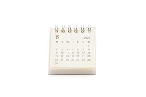 Simple desk calendar for JUNE 2025 isolated on white background. Calendar concept with copy space. 2025 JUN calendar. photo