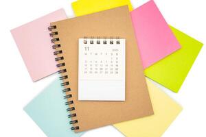 Simple desk calendar for NOVEMBER 2025 with Sticky note. Calendar concept with copy space. 2025 NOV calendar. photo