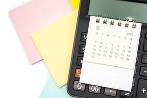 Simple desk calendar for JUNE 2025 on calculator. Calendar concept with copy space. 2025 JUN calendar. photo