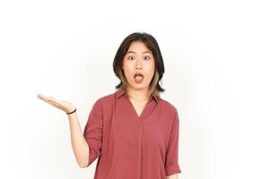 Showing and Presenting Product on Open Palm Of Beautiful Asian Woman Isolated On White Background photo