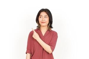 Showing Product and Pointing Side Of Beautiful Asian Woman Isolated On White Background photo