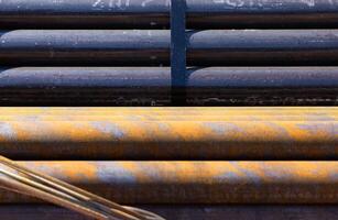 Steel reinforcement bars stacked in a stack. Copy space photo