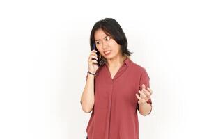 Make a Phone Call Using smartphone with angry face Of Beautiful Asian Woman Isolated On White Background photo