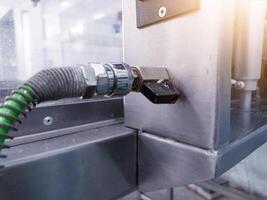 The hand man Connect to quick couplers in air pneumatic system on the manchinery. photo