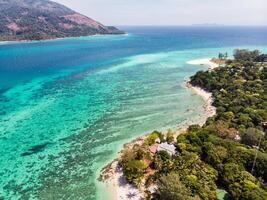 View of coral reef in emerald sea at lipe island photo
