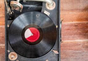 Retro vinyl record disk player in old box photo