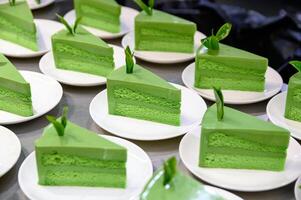 Green tea matcha cake slices with leaf photo