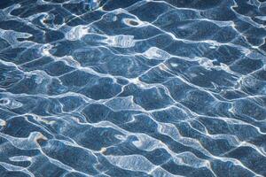 refelction an ripples on the water in the pool, color background photo