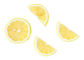 Set of fresh yellow lemon fruit in halves and slices or quarter scattering isolated on white background with clipping path Top view photo
