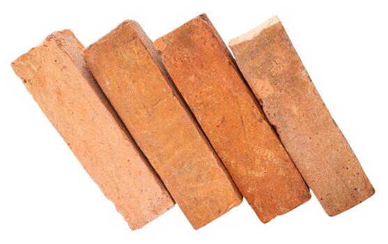 Side view of four old red or orange bricks in stack isolated on white background with clipping path photo