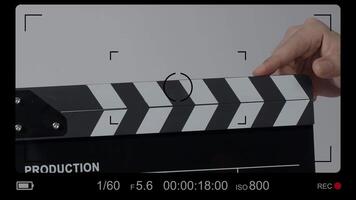 Close up hand holding empty film slate and clapping in front of camera. video