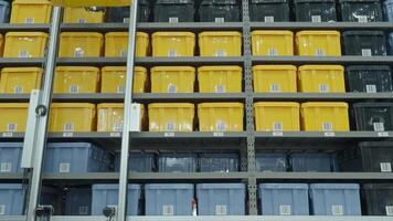 Smart warehouse management system with robotic handling system. Automated robotic tote arranging distribution product stock on shelf in modern factory. AI Technology Logistic concept. video