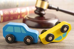 Hammer gavel judge with car vehicle accident, insurance coverage claim lawsuit court case. photo