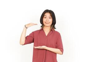 Measuring and Showing Big Sign Product Of Beautiful Asian Woman Isolated On White Background photo