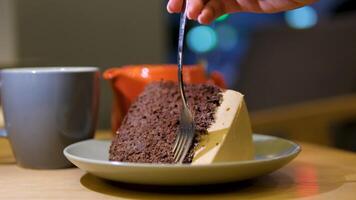 Biting a delicious piece of chocolate cake.Eating chocolate cake. Taking bite of moist delicious chocolate cake with a fork video