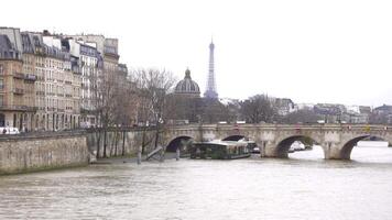 Eiffel Tower and Historic Parisian Bridge Across the Scenic Seine River video