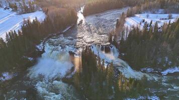 Swedish Winter River Winding Through Snowy Forests Under Golden Sunlight Glow video