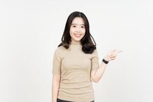 Showing Product and Pointing Side Of Beautiful Asian Woman Isolated On White Background photo
