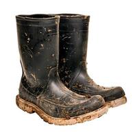 A pair of dirty black rubber boots photo