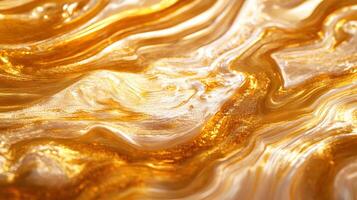 A gold and white swirl pattern with a shiny texture photo