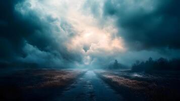 A desolate road with a cloudy sky in the background photo