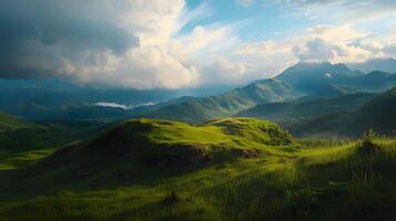 A mountain range with a cloudy sky and a green hillside photo