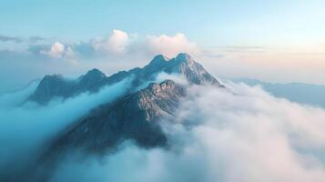 The sky is blue and cloudy with a mountain in the background photo