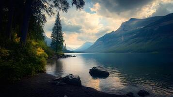 A beautiful mountain lake with a tree in the foreground photo