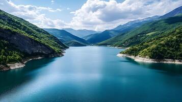 A beautiful lake with mountains in the background photo