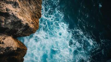 A rocky shoreline with a body of water in the background photo