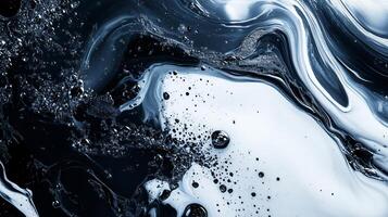 A painting of a blue and white swirl with a lot of black and white specks photo
