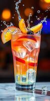 Refreshing fruit cocktail served in a tall glass with ice and splashes at a vibrant bar photo
