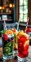 Colorful fruit drinks in stylish glasses on wooden table in a cozy setting photo