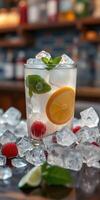 Refreshing summer cocktail with mint and fruits served on ice at a cozy bar photo