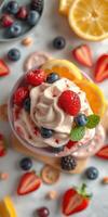 Delicious dessert bowl topped with fresh strawberries, blueberries, and mint leaves on a vibrant table photo