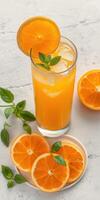 Refreshing citrus drink garnished with mint and orange slices on a light background photo