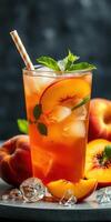 Refreshing peach tea with fresh mint leaves and ripe peaches garnished with ice photo