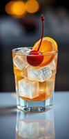 Colorful cocktail garnished with cherry and orange served in a modern glass photo