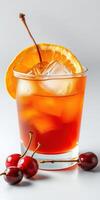 Refreshing cocktail with orange slice and cherries on a light background perfect for summer gatherings and celebrations photo