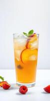 Refreshing summer drink in a glass with sliced fruit and mint leaves on a minimalistic background photo
