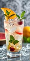 Refreshing summer cocktail with fruits and mint served on ice at a vibrant gathering photo