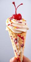 Indulging in a classic ice cream cone with a cherry and colorful sprinkles on a sunny day photo