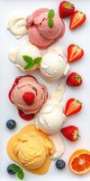 Colorful assortment of ice cream with fresh fruit in a vibrant display on a white plate photo