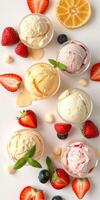 Colorful assortment of ice cream scoops with fresh fruit on a white background during a summer celebration photo